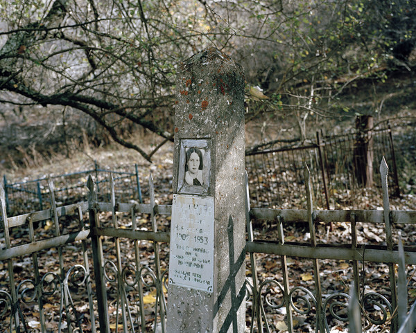 A Soviet grave with a picture of a woman.
