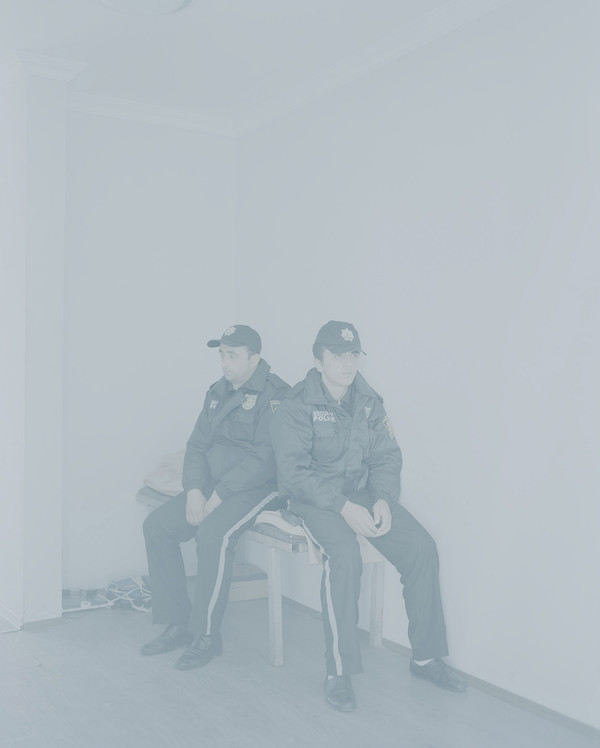 Georgia. Batumi. 2013. Police officers guarding the entrance to the Alphabetic Tower.